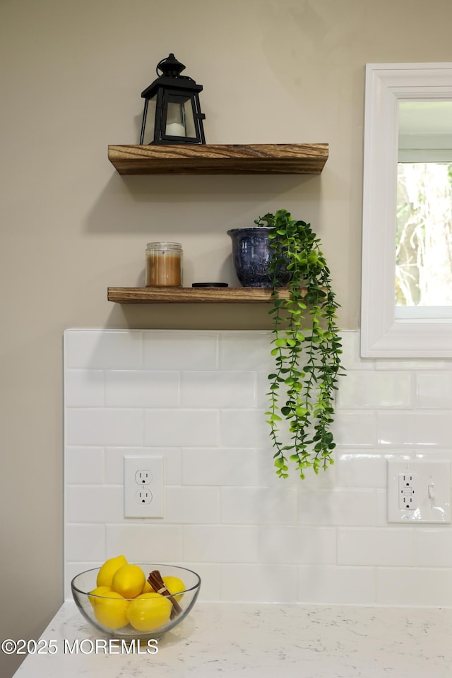 detailed view of decorative backsplash and open shelves