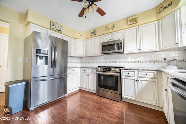 17B Drake St, Whiting, NJ 08759 - kitchen featuring appliances with stainless steel finishes, ceiling fan, backsplash, dark wood-style floors, and light stone countertops