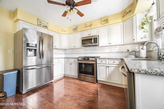 17B Drake St, Whiting, NJ 08759 - kitchen featuring stainless steel appliances, a sink, a ceiling fan, light stone countertops, and dark wood-style flooring