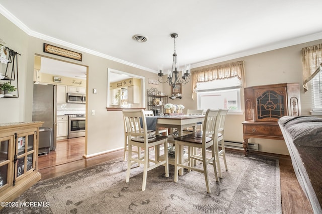 17B Drake St, Whiting, NJ 08759 - dining space featuring wood finished floors, ornamental molding, a chandelier, and baseboard heating