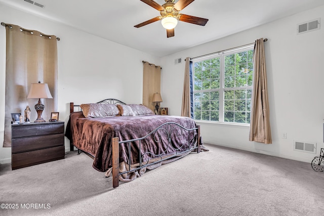 bedroom with carpet flooring, baseboards, and a ceiling fan