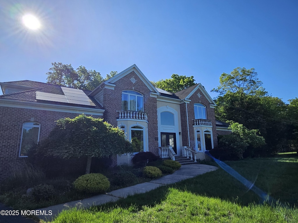 1979 Pamela Ct, Toms River, NJ 08755 - view of front of home featuring brick siding and a front lawn