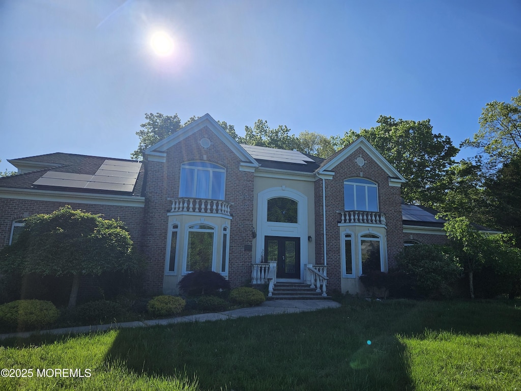 1979 Pamela Ct, Toms River, NJ 08755 - view of front of home featuring french doors, brick siding, and a front lawn