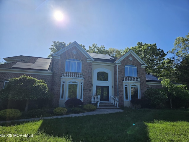 1979 Pamela Ct, Toms River, NJ 08755 - view of front of home featuring french doors, brick siding, and a front lawn