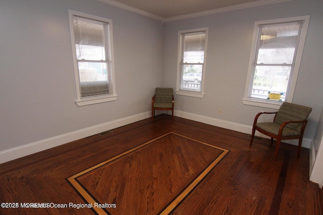 unfurnished room featuring healthy amount of natural light, baseboards, ornamental molding, and dark wood-type flooring