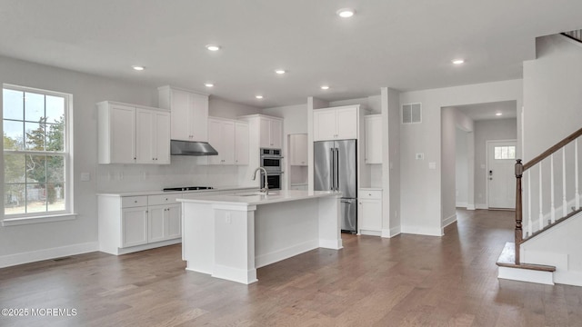 15 Hulse Landing Rd, Brick, NJ 08723 - kitchen featuring stainless steel appliances, under cabinet range hood, plenty of natural light, white cabinets, and recessed lighting