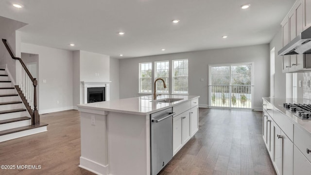 15 Hulse Landing Rd, Brick, NJ 08723 - kitchen featuring a sink, wall chimney range hood, stainless steel appliances, recessed lighting, and baseboards