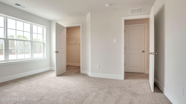 15 Hulse Landing Rd, Brick, NJ 08723 - unfurnished bedroom with light colored carpet, baseboards, a walk in closet, and a closet