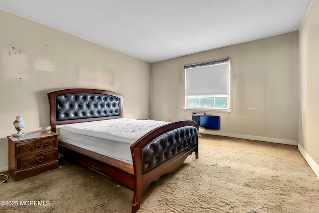 carpeted bedroom featuring baseboards and a wall mounted air conditioner