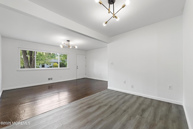 15 Lark Ln, Brick, NJ 08724 - spare room with a chandelier, dark wood finished floors, and baseboards