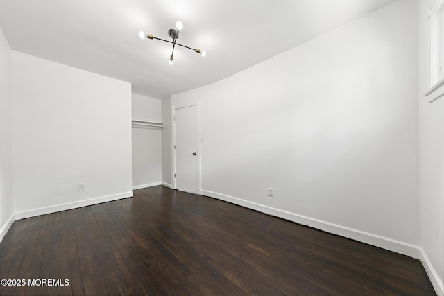 15 Lark Ln, Brick, NJ 08724 - unfurnished bedroom featuring dark wood-style floors, baseboards, a chandelier, and a closet