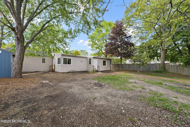 15 Lark Ln, Brick, NJ 08724 - rear view of property featuring fence and entry steps