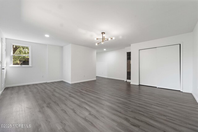 15 Lark Ln, Brick, NJ 08724 - unfurnished living room featuring a chandelier, baseboards, wood finished floors, and recessed lighting