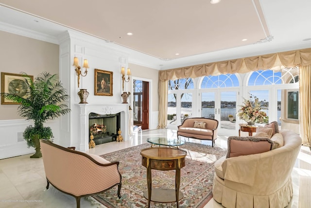 1015 Forrest Rd, Brielle, NJ 08730 - living room featuring ornamental molding, a warm lit fireplace, a water view, and recessed lighting