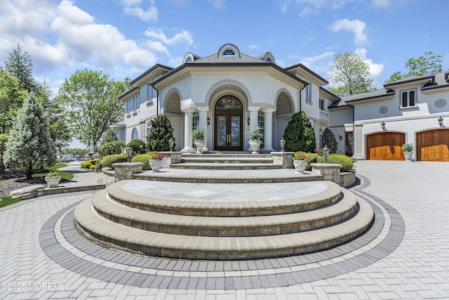 1015 Forrest Rd, Brielle, NJ 08730 - view of front of home featuring french doors, curved driveway, and stucco siding