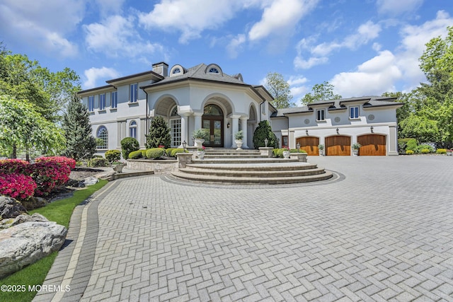 1015 Forrest Rd, Brielle, NJ 08730 - view of front of house with curved driveway, stucco siding, and french doors