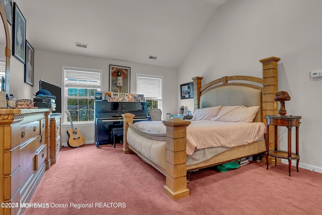 bedroom featuring light colored carpet, baseboards, and lofted ceiling