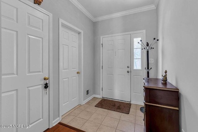 59 Inwood Dr, Manalapan, NJ 07726 - foyer entrance with crown molding, light tile patterned flooring, and baseboards