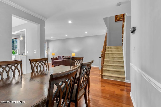 59 Inwood Dr, Manalapan, NJ 07726 - dining area featuring stairs, light wood-style floors, recessed lighting, and ornamental molding