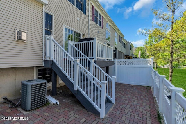 59 Inwood Dr, Manalapan, NJ 07726 - fenced backyard featuring central air condition unit, a patio area, and a deck