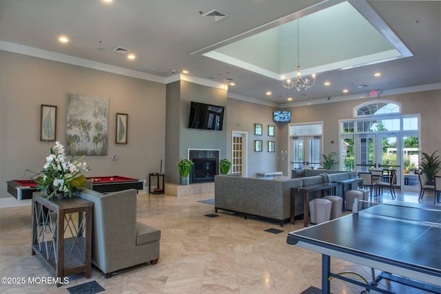 59 Inwood Dr, Manalapan, NJ 07726 - living area featuring billiards, french doors, ornamental molding, recessed lighting, and a tiled fireplace