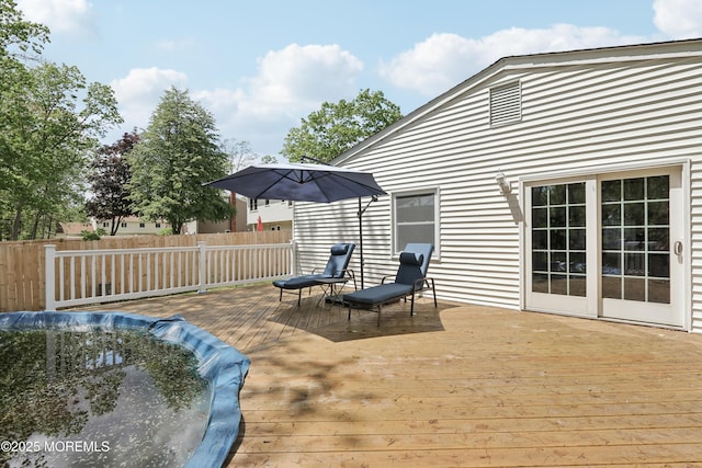 wooden deck featuring fence
