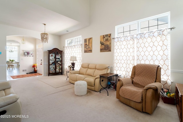 7 Salem Ct, Barnegat, NJ 08005 - living room with arched walkways, healthy amount of natural light, and carpet