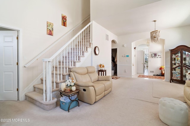 7 Salem Ct, Barnegat, NJ 08005 - living room with arched walkways, carpet, and stairs