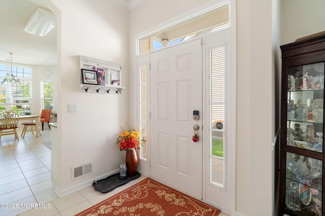7 Salem Ct, Barnegat, NJ 08005 - foyer entrance featuring light tile patterned floors, a chandelier, and baseboards
