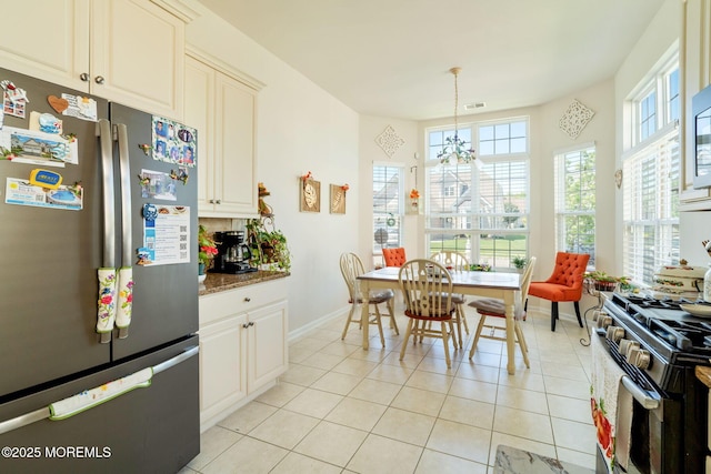 7 Salem Ct, Barnegat, NJ 08005 - kitchen featuring freestanding refrigerator, gas range oven, baseboards, light tile patterned floors, and hanging light fixtures