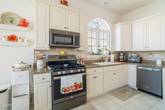 7 Salem Ct, Barnegat, NJ 08005 - kitchen with appliances with stainless steel finishes, a sink, tasteful backsplash, light tile patterned floors, and white cabinets