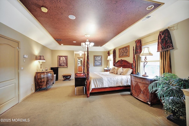 carpeted bedroom with a tray ceiling, a chandelier, and recessed lighting