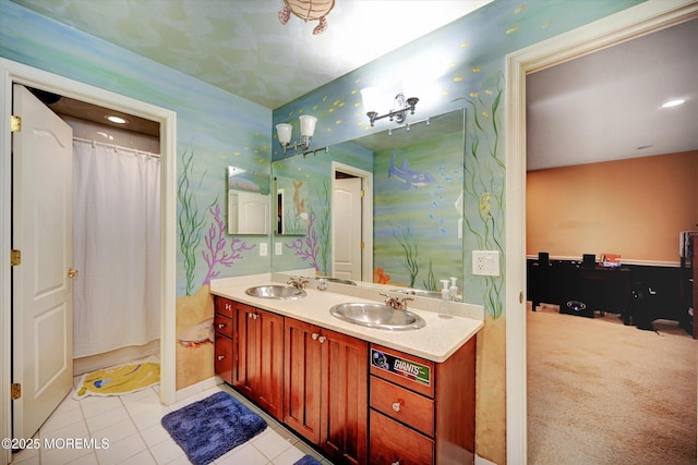 bathroom with double vanity, tile patterned flooring, wallpapered walls, baseboards, and a shower with shower curtain