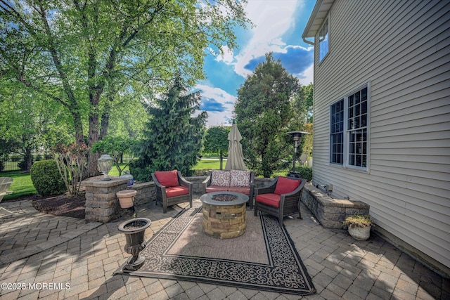 view of patio with a fire pit