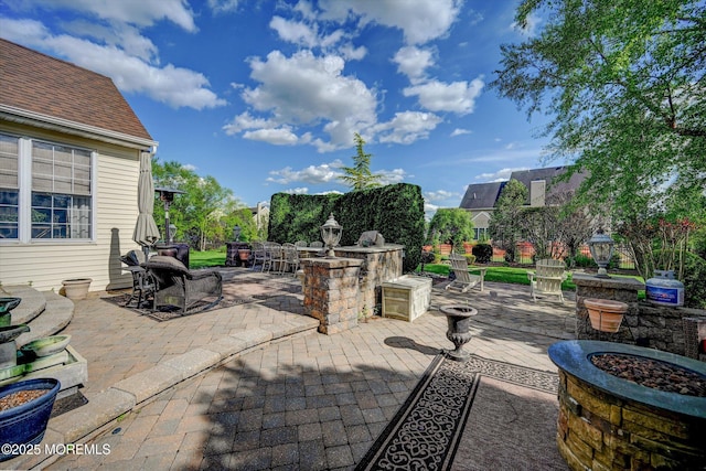 view of patio featuring a fire pit
