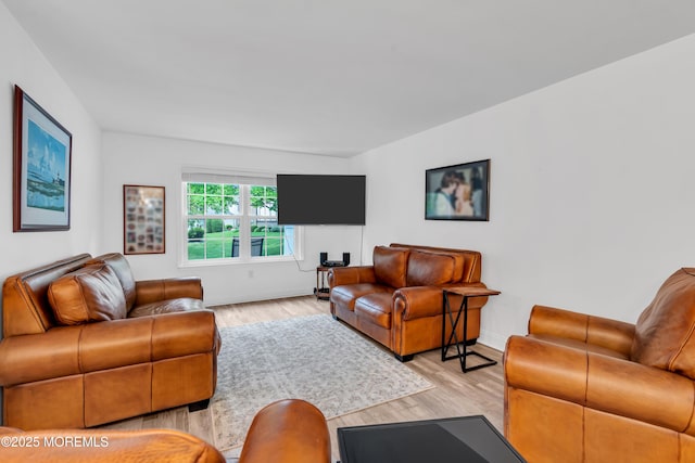living room featuring light wood-style floors and baseboards