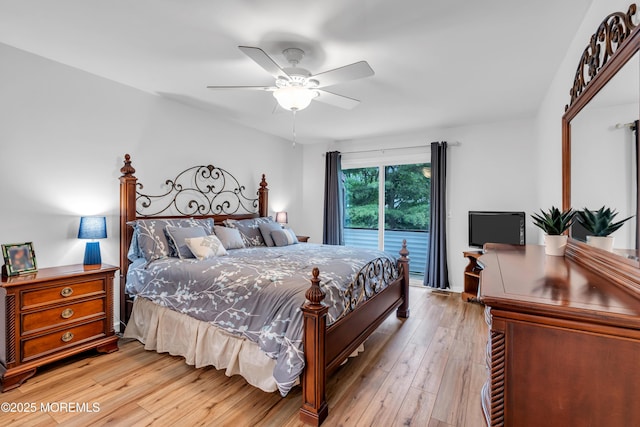 bedroom featuring access to exterior, light wood-type flooring, and a ceiling fan