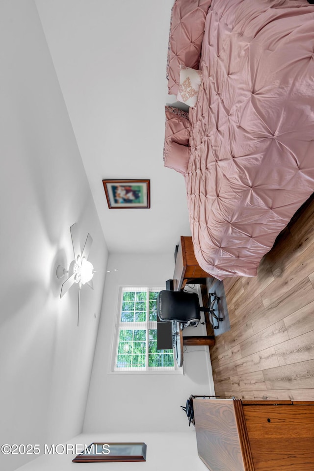 bedroom with wooden walls