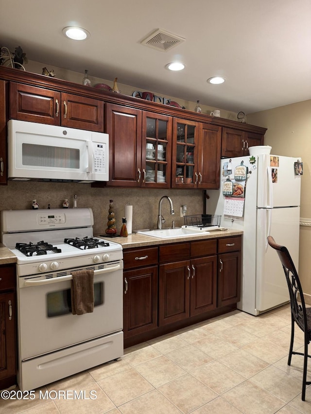 16B Robin St Unit 16B, Manchester, NJ 08759 - kitchen featuring white appliances, light countertops, a sink, dark brown cabinetry, and recessed lighting