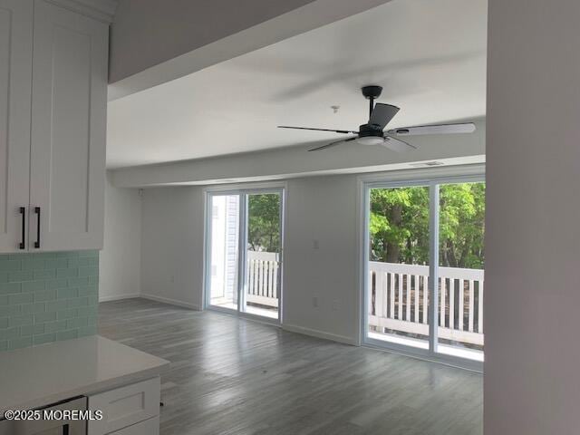 1912 Schley Ave, Toms River, NJ 08755 - unfurnished living room with healthy amount of natural light, a ceiling fan, and baseboards