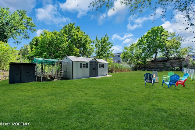 view of yard featuring a shed, an outdoor structure, and exterior structure
