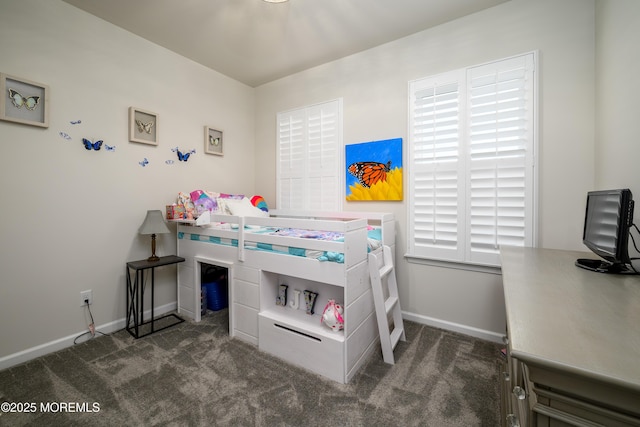 bedroom featuring carpet floors, baseboards, and an office area