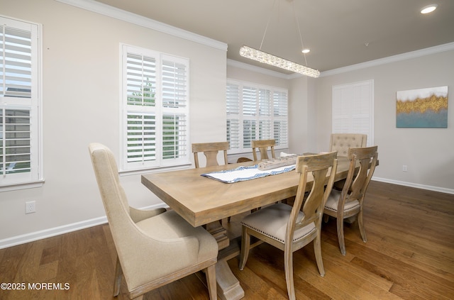 dining area featuring crown molding, wood finished floors, baseboards, and recessed lighting