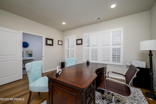 office space with wood finished floors, recessed lighting, and baseboards