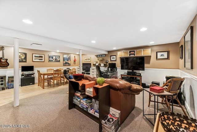 carpeted living area featuring wainscoting, recessed lighting, and an office area