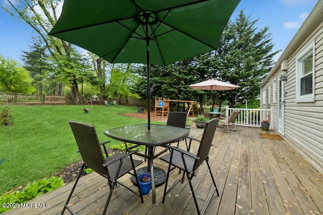 deck with outdoor dining area