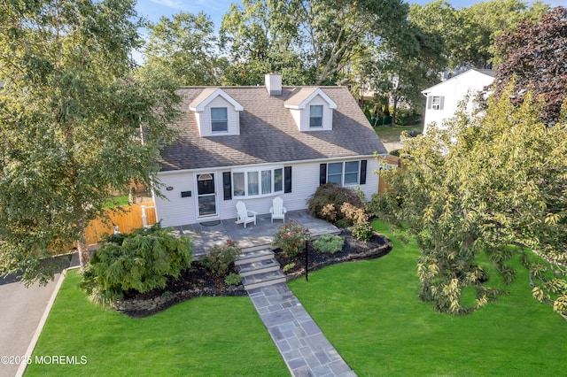 cape cod-style house with a chimney and a shingled roof