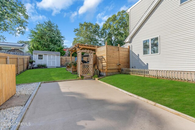 view of patio featuring a storage unit, an outdoor structure, and a pergola
