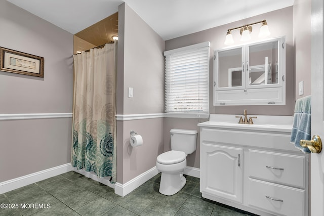 full bathroom featuring baseboards, toilet, vanity, and tile patterned flooring