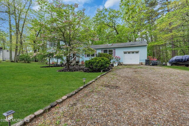 441 E Bird Village Rd, Jackson, NJ 08527 - view of front of home with a garage, dirt driveway, and a front lawn